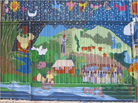 Reproduction of “Vida y sueños de la cañada Perla” [“Life and Dreams of the Perla River Valley”], Mexican side of the U.S. wall at the U.S.-Mexico Border, Nogales, Mexico. Originally painted in Taniperla, Chiapas by Sergio Valdéz Ruvalcaba and destroyed by paramilitary